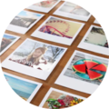 Close-up of colorful photos on a table, capturing memories