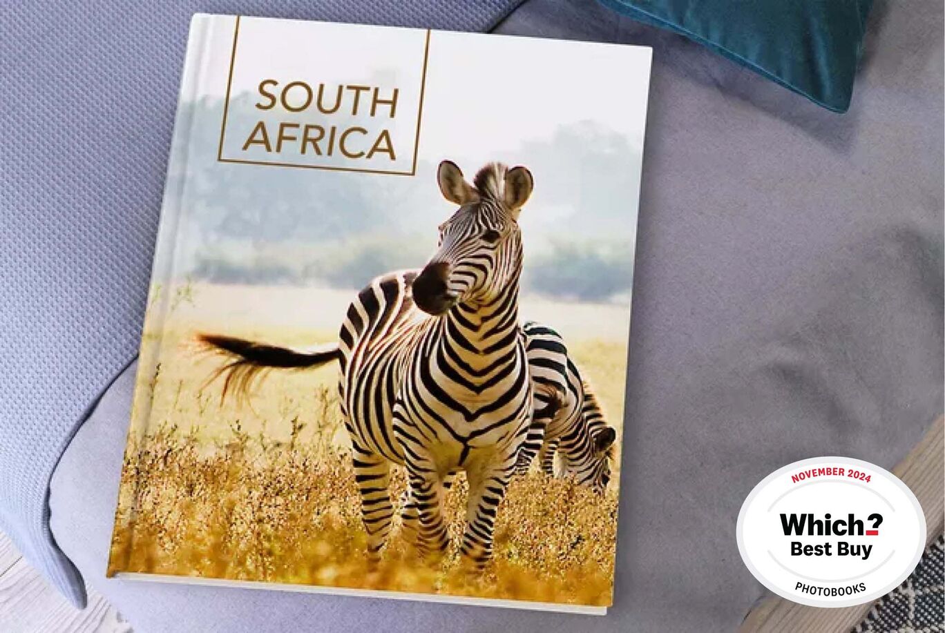 A beautiful CEWE PHOTO BOOK featuring a picture of zebras in the African landscape.